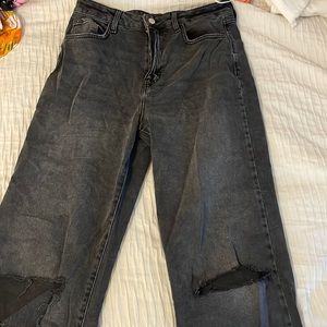Black straight jeans with 2 knee rips